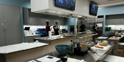 Student and Instructor get ready to lead a class in the Teaching Kitchen
